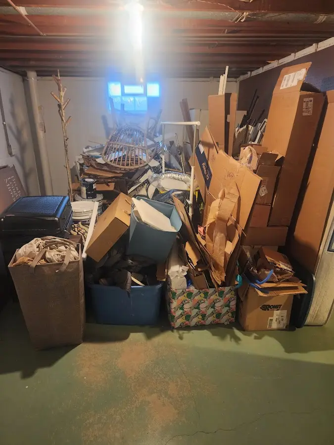 Roll-off dumpster container at job site for Yard Waste Dumpster Rental in Bellefontaine Neighbors